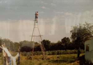 The metal frame of a windmill with Uncle Jelle at the top!