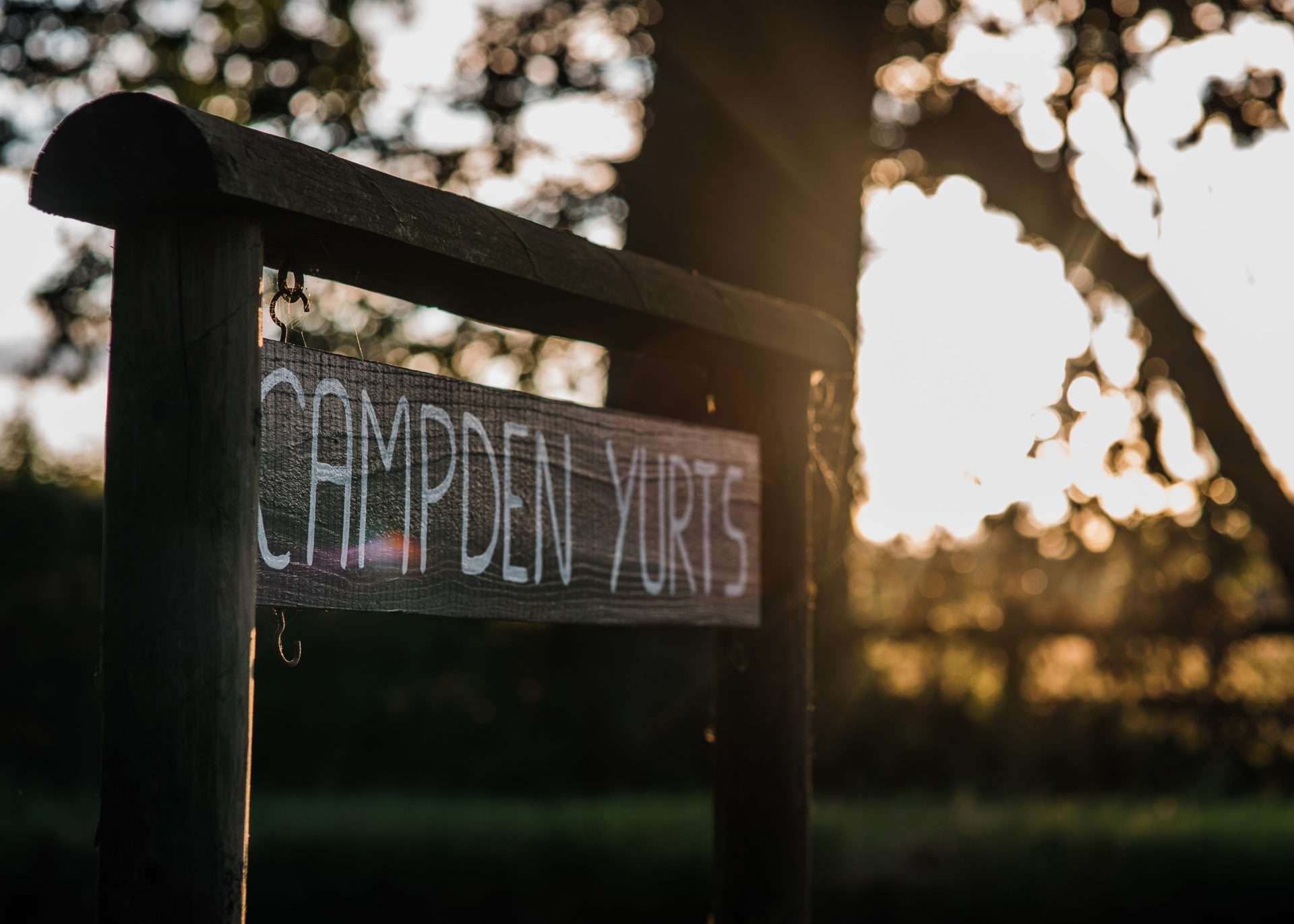 Wooden sign of Campden Yurts